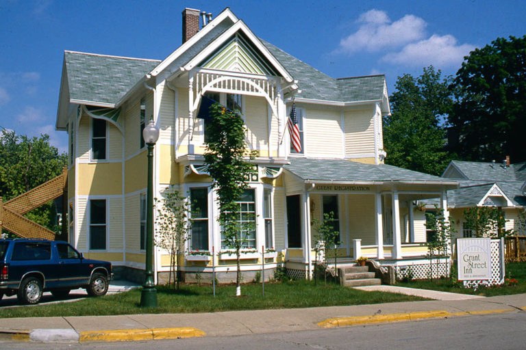 Grant Street Inn's exterior – restored 1890's character dressed in a charming landscape.