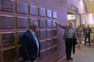 Jim Murphy reveals the new Monroe County Hall of Fame plaques.