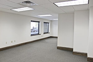 100 S. College Ave, Suite 001, offers an open floor plan with windows.