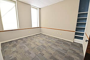 One City Centre, Suite 208, office four of five offers lots of natural light and a built-in book shelf.