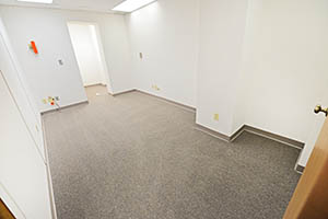 Spacious elongated suite with a storage room.