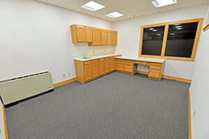 Fountain Square, Suite 230, offers a spacious room with a kitchenette.