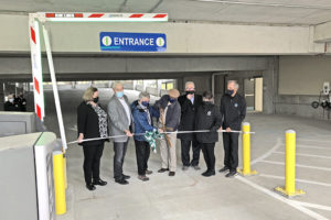 Representatives supporting the Trades District Garage cut the grand opening ribbon.