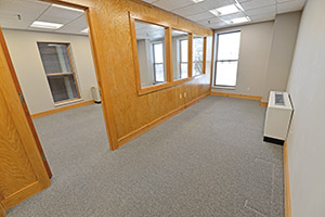 Fountain Square, Suite 307, elongated office with windows and natural light.
