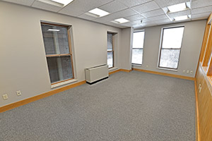Fountain Square, Suite 307, private office with multiple windows and natural light. Offers an adjoining door to the office next to it.