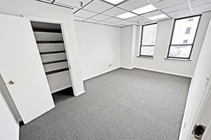 Graham Plaza, suite 315, one of two private offices. Provides two windows and a storage closet.