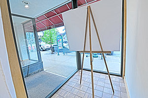 Uptown Plaza, Suite 115, offers two large displays windows that face College Avenue. Image shows display platform in display window with a glimpse of the second display window.