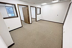 Graham Plaza, suite 450, second view of the reception area. The reception area leads to two private offices. Each office offers a window on the wall between the reception area.