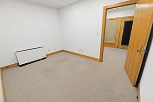 Fountain Square, Suite 212, shows a spacious private office that opens to the reception area.