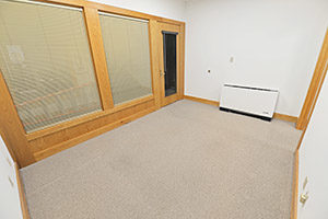 Fountain Square, Suite 212, shows a spacious reception area with two large windows.